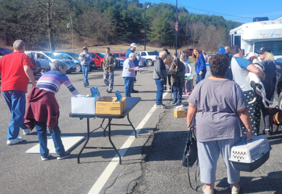 people and pets at TCHS low cost pet health clinic